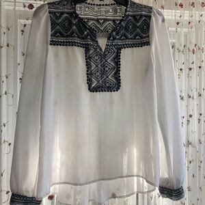 Long sleeve white gauze shirt w unique black trim.